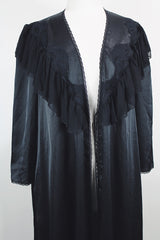 Women's vintage 1990's Blanche label long sleeve maxi length black wrap duster robe. Has lace and ruffle trim. Lightweight Polyester material.