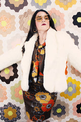 Women's vintage 1970's Wilsons Suede & Leather, Made in Korea label long sleeve bright white genuine fur coat with one hook and eye closure in the front.