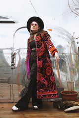 Women's vintage 1970's Dynasty label long sleeve long length velvet material puffy duster jacket in black, purple, and pink colors.