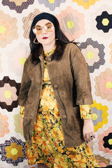 Women's vintage 1960's Emerald Fine Fashions label 3/4 arm length long tan suede mod style jacket with genuine fur trim around neck.