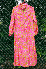 Women's vintage 1970's Bellariva label long sleeve ankle length button up shirt dress with collar. All over pink and orange floral print.