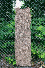 Women's vintage 1990's Maggy London label sleeveless midi length dress in an all over brown leopard print in a silk material. Wrap tie front detail.