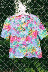 Women's vintage 1980's Leslie Fay matching set in an all over multicolored ditsy floral print. Short sleeve blazer jacket and midi pencil skirt.