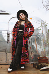 Women's vintage 1970's Dynasty label long sleeve long length velvet material puffy duster jacket in black, purple, and pink colors.