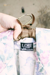 Women's vintage 1980's LORI of California by AM Casuals label long sleeve floral print blazer with one button closure. White with pink and blue flowers. Lightweight cotton material.