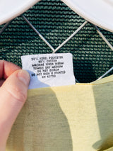 Women's or men's vintage 1980's Surf Gear label XL sleeveless yellow tank top t-shirt with Pismo Beach multicolored graphic on the front.