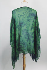 Women's vintage 1990's green and navy sheer polyester material cape top. Has no armholes, just a hole for your head. Tie dye print.
