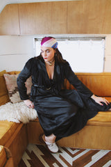 Women's vintage 1990's Blanche label long sleeve maxi length black wrap duster robe. Has lace and ruffle trim. Lightweight Polyester material.