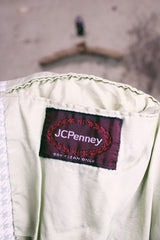 Women's or men's vintage 1970's JCPenny label long sleeve blazer in polyester material. Has a all over light green and white houndstooth print.