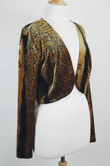 Women's vintage 1990's High Drama label long sleeve cropped fit open front velvet top with an all over black and gold snakeskin print.