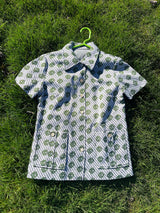 Women's vintage 1970's short sleeve button up shirt blouse in green and white print in polyester material.