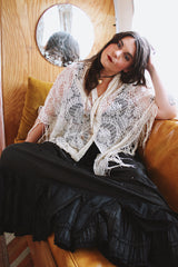 1970's cream colored lace triangle shaped scarf with long fringe trim that can also be worn as a shawl.