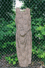 Women's vintage 1990's Maggy London label sleeveless midi length dress in an all over brown leopard print in a silk material. Wrap tie front detail.