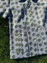 Women's vintage 1970's short sleeve button up shirt blouse in green and white print in polyester material.