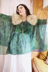 Women's vintage 1990's green and navy sheer polyester material cape top. Has no armholes, just a hole for your head. Tie dye print.