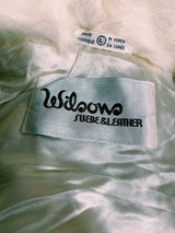 Women's vintage 1970's Wilsons Suede & Leather, Made in Korea label long sleeve bright white genuine fur coat with one hook and eye closure in the front.