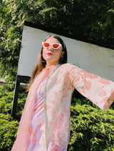 Women's vintage 1970's open front silver metallic blouse with short sleeves and all over white and pink rose floral print.