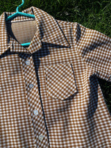 Women's vintage 1970's short sleeve button up shirt blouse in brown and white checkered print polyester material.