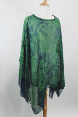 Women's vintage 1990's green and navy sheer polyester material cape top. Has no armholes, just a hole for your head. Tie dye print.