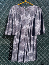 Women's vintage 1970's short length short sleeve grey printed dress with big bell sleeves in a cotton material.