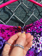 Women's vintage 1970's long sleeve maxi length dress in purple and multicolored floral print in polyester material.