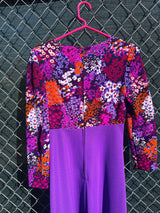 Women's vintage 1970's long sleeve maxi length dress in purple and multicolored floral print in polyester material.