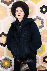 Women's vintage 1980's Luh - London, Paris, New York label long sleeve zip up jacket in black with genuine fir body and ribbed knot arms. Balloon shaped arms.