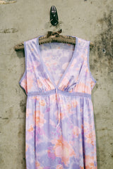 Women's vintage 1980's sleeveless midi length nightie dress in light purple, pink, and peach all over tie dye print. Has lace trim.