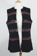 Women's vintage 1970's Palena Knitwear, Made in Hong Kong label sleeveless black wool vest with brass buckles closures up the front and floral trim details.