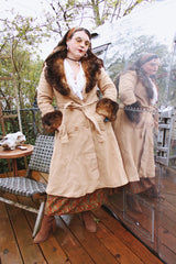 Women's vintage 1970's Domino, New York label long sleeve knee length light tan camel colored wool coat with brown genuine fur trim around collar and cuffs.