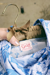 Women's vintage 1970's Graff Californiawear label long sleeve top with a cowl neck and all over blue floral print.