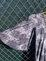 Women's vintage 1970's short length short sleeve grey printed dress with big bell sleeves in a cotton material.