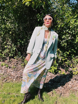 Women's or men's vintage 1970's JCPenny label long sleeve blazer in polyester material. Has a all over light green and white houndstooth print.