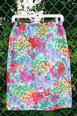 Women's vintage 1980's Leslie Fay matching set in an all over multicolored ditsy floral print. Short sleeve blazer jacket and midi pencil skirt.