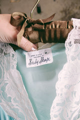 Women's vintage 1980's Fashion by Becky Sharpe, Made in USA label light blue nightie top with short sleeves and lace trim throughout.