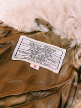 Women's vintage 1970's Dino Ricco, Made in Hong Kong label Penny Lane long sleeve genuine fur coat with a brown body and big cream fur trim on neck.