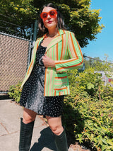 Women's vintage 1970's Jack Winter label long sleeve striped blazer with gold button closure. Lime green, orange, and tan colors in polyester material.