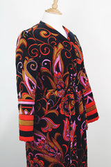 Women's vintage 1970's Dynasty label long sleeve long length velvet material puffy duster jacket in black, purple, and pink colors.
