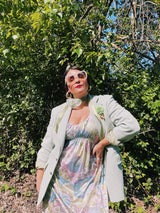 Women's vintage 1970's sleeveless ankle length maxi dress. Nightgown loungewear style with an all over pink, green, and blue pastel colored print.