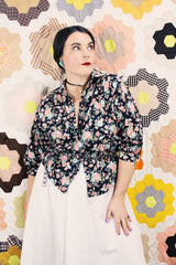 Women's vintage 1970's Ship N' Shore label short sleeve all over ditsy floral print blouse that buttons up the front and cinches at the waist.