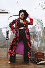 Women's vintage 1970's Dynasty label long sleeve long length velvet material puffy duster jacket in black, purple, and pink colors.