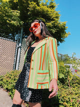 Women's vintage 1970's Jack Winter label long sleeve striped blazer with gold button closure. Lime green, orange, and tan colors in polyester material.