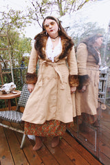 Women's vintage 1970's Domino, New York label long sleeve knee length light tan camel colored wool coat with brown genuine fur trim around collar and cuffs.