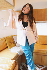 Women's vintage 1960's traditional kimono robe jacket in a pale pink color. Silk material with floral embroidery throughout.