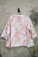 Women's vintage 1970's open front silver metallic blouse with short sleeves and all over white and pink rose floral print.