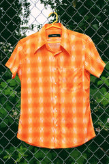 Women's or men's vintage Y2k Mediterranea, Made in Italy label short sleeve button. up shirt with an all over vibrant orange print.