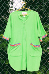 Women's vintage 1980's David Brown for Saks Fifth Avenue short sleeve mini length zip up towel material dress in a vibrant lime green and printed pink trim.