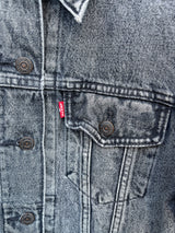 Women's Levi's black grey wash long sleeve button up lightweight jacket with brass hardware and pockets.