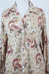 Women's vintage 1970's Stephanie, K by Koret label long sleeve button up blouse with small dagger collar in tan color and all over pale pink paisley print.
