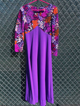 Women's vintage 1970's long sleeve maxi length dress in purple and multicolored floral print in polyester material.